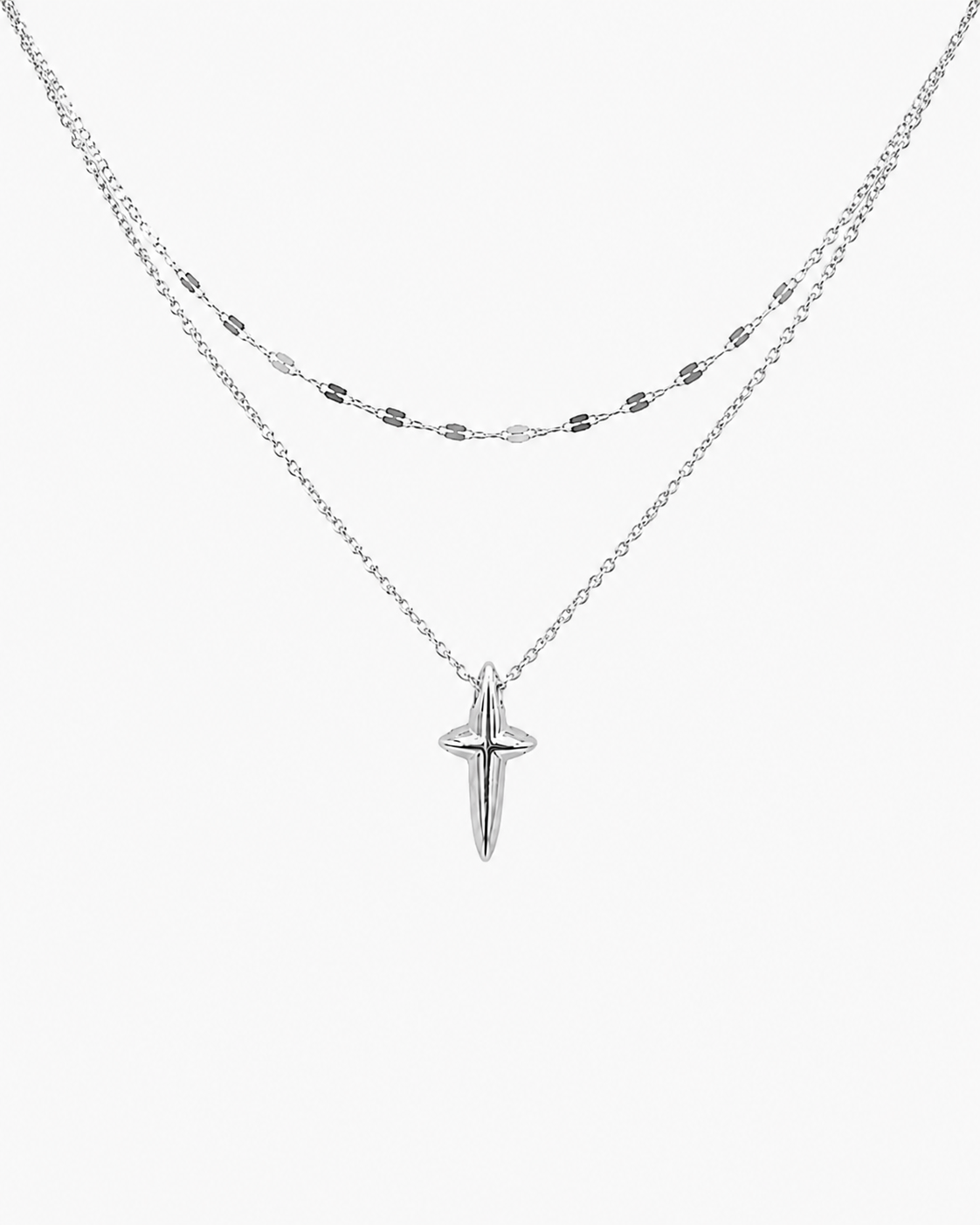 Layered cross pendant necklace detail