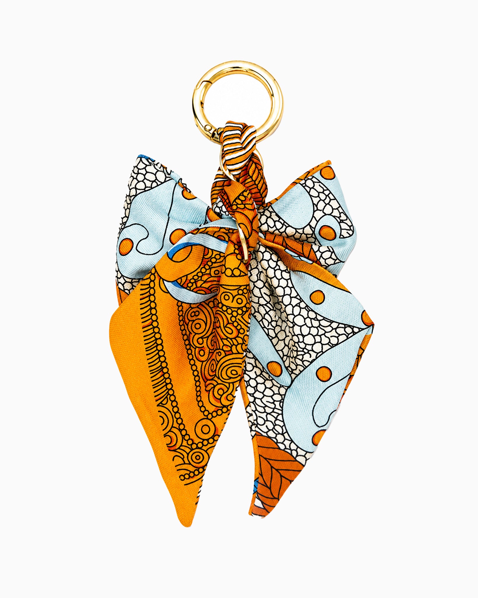 Braided Scarf Bow Bag Charm in orange — braided fabric scarf bow with a pearl-beaded loop clip