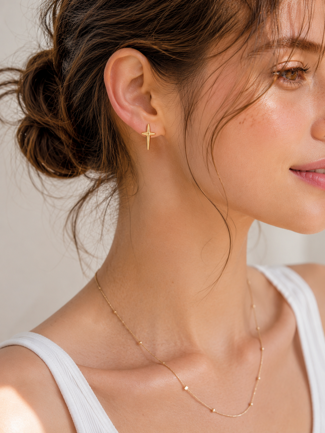 Minimalist cross stud earrings detail